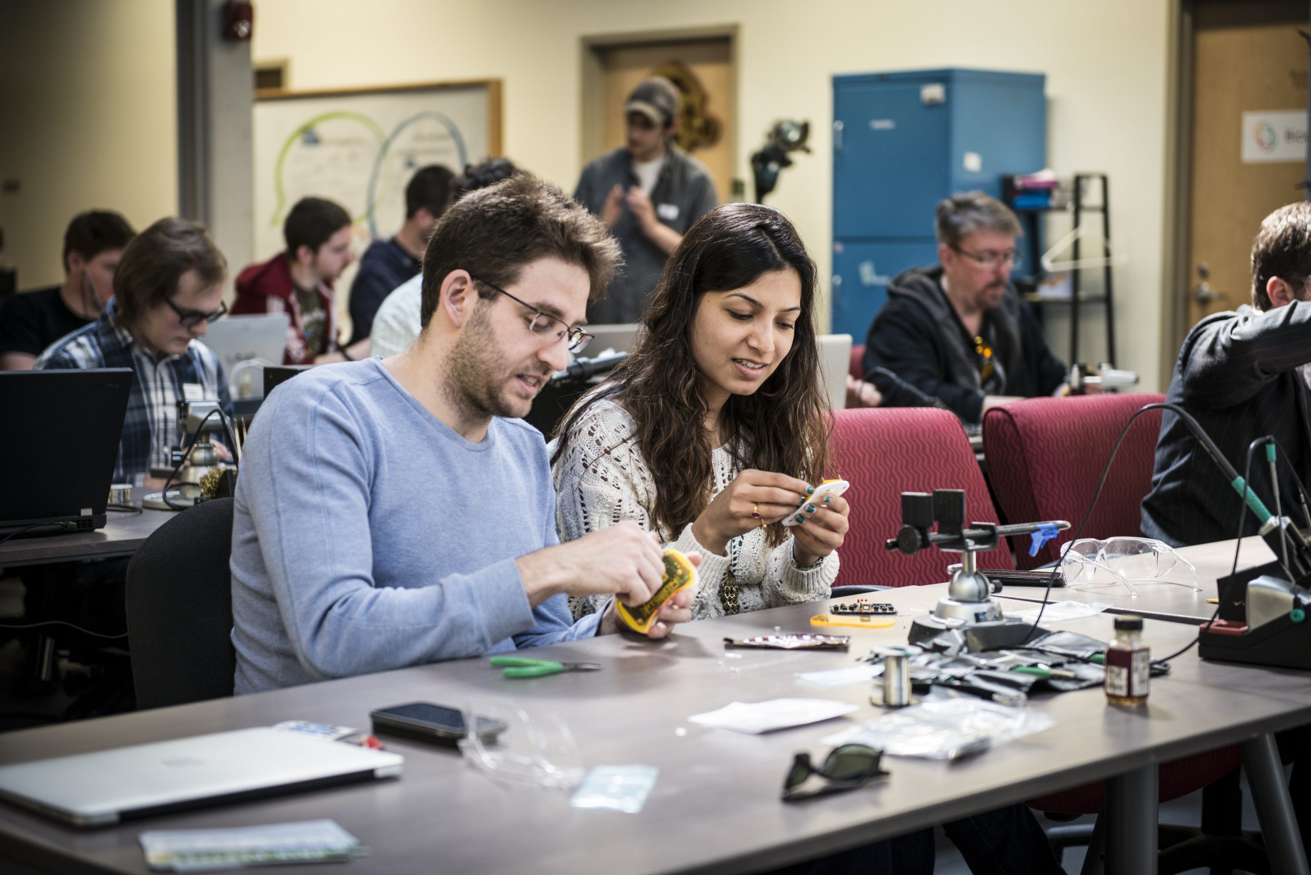 Electronics Class team members soldering