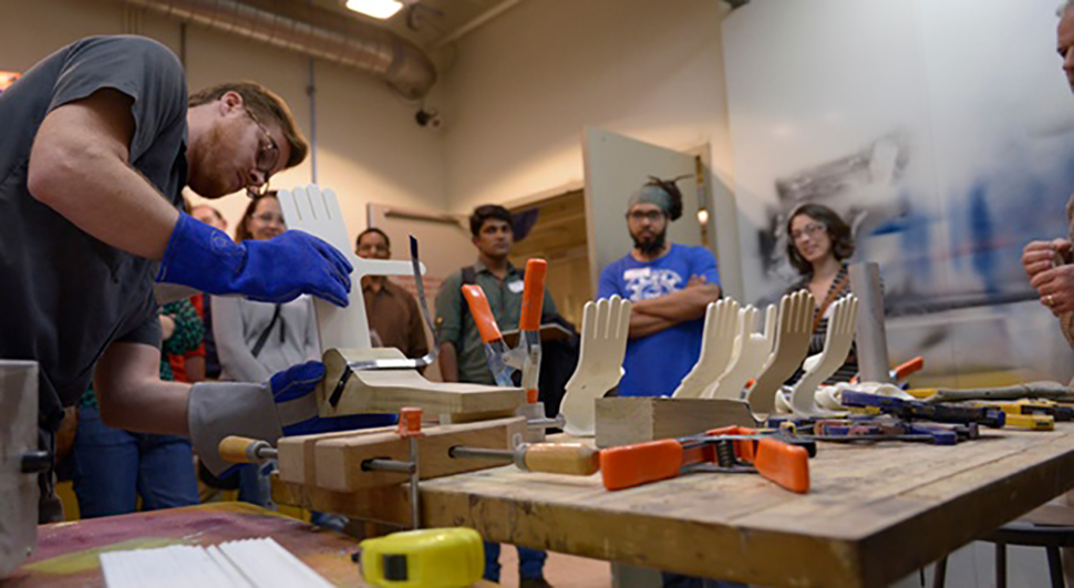 Students thermoforming at NextFab