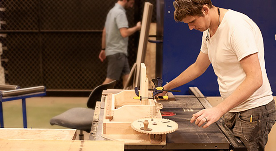 Jesse Frome working in the NextFab wood shop
