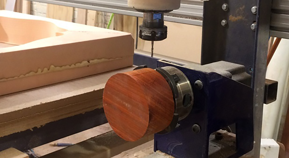 Cutting the USB port hole on the Padauk base cylinder at NextFab