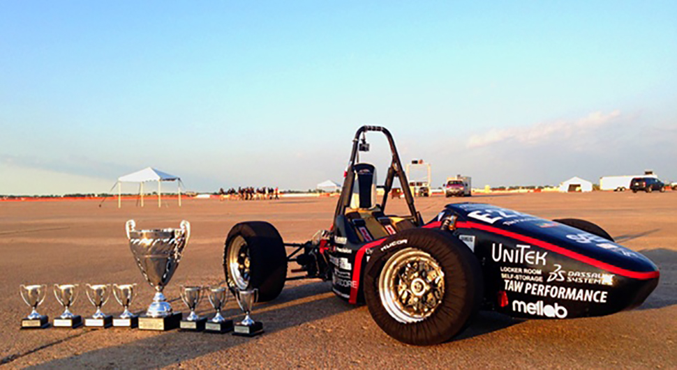 UPenn Electric Race Team race car with trophies