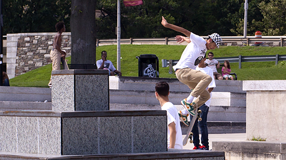 Skateboarders using the new skate park installation made at NextFab
