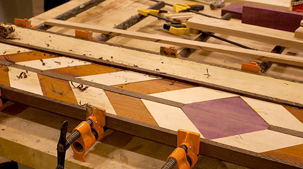 Close up of wooden table top inlays