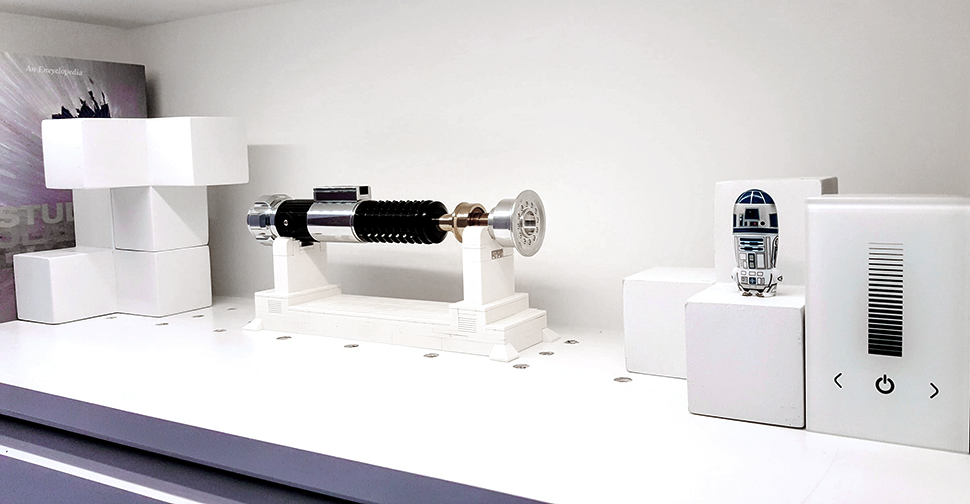 Wall unit displaying replica Light Saber