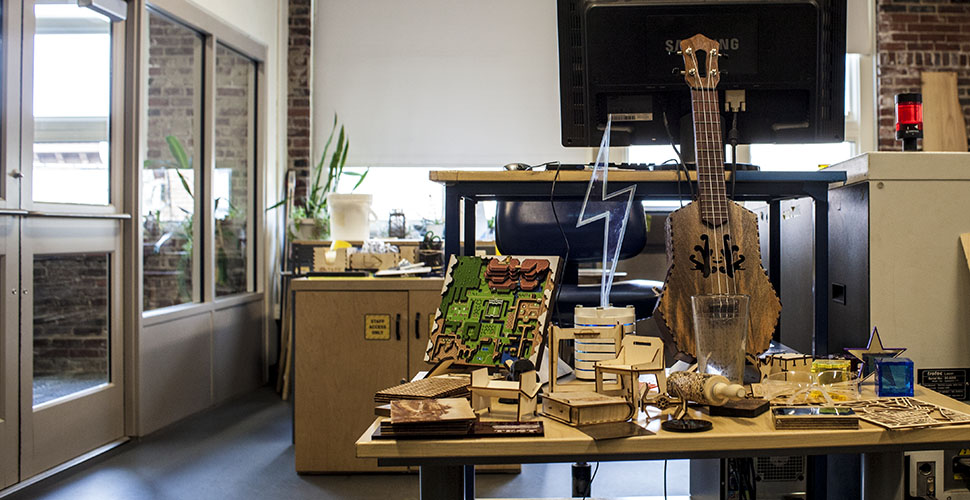 Ben Fries Lab with fabricated artwork made at NextFab makerspace