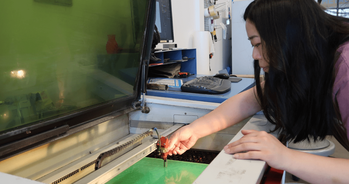 Laura in the NextFab Laser Studio
